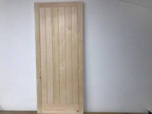wooden door with vertical panels